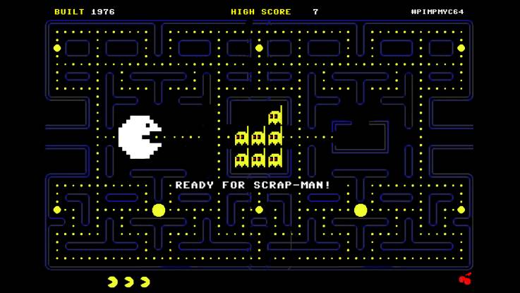 Grafik: Auf der labyrinthartigen, schwarzgrundigen Bedienoberfläche des Videospiels «Pac-Man» erscheint links die Spielfigur in Weiß; in der Zentralkammer des Labyrinths befinden sich sieben gelbe Symbole in Form kleiner Atomkraftwerke. Darunter sticht der Schriftzug «Ready for Scrap-Man» weiß hervor.